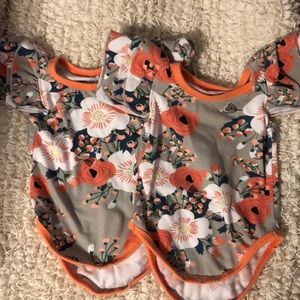 Two onesies. One is 0-3M and one is 3-6M